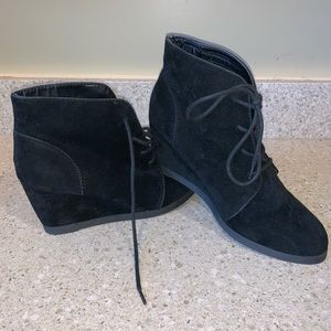 Black lace-up ankle booties with wedge heel